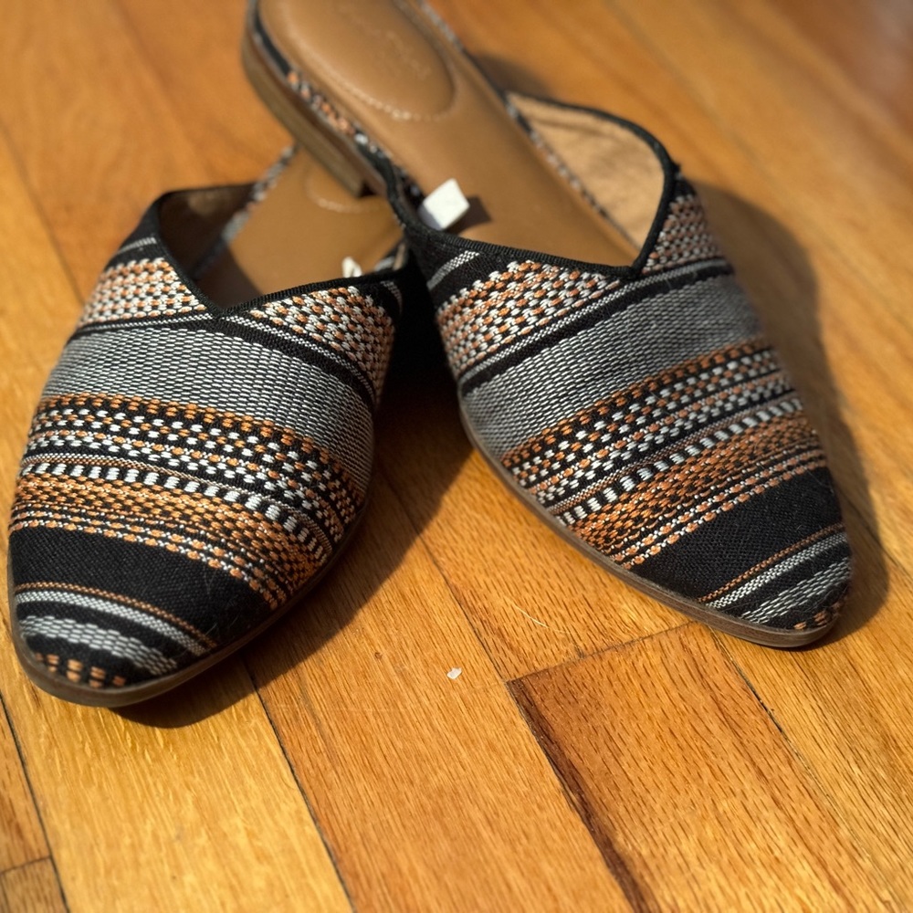 Black and brown slip on mules flats